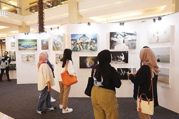 Visitors appreciate the exhibits and exchange ideas at the Changing Asia 