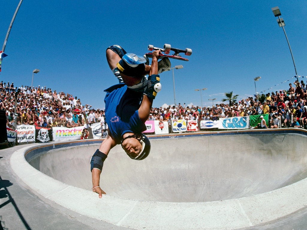 DEL MAR, CA - AUGUST 01, 1985:  Steve Caballero, riding for Powell Peralta, does an invert during competition at the National Skateboarding Association event at the Del Mar Skate Ranch. (Photo by Doug Pensinger/Getty Images)
